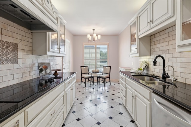 kitchen featuring tasteful backsplash, stainless steel dishwasher, a sink, black electric cooktop, and light floors
