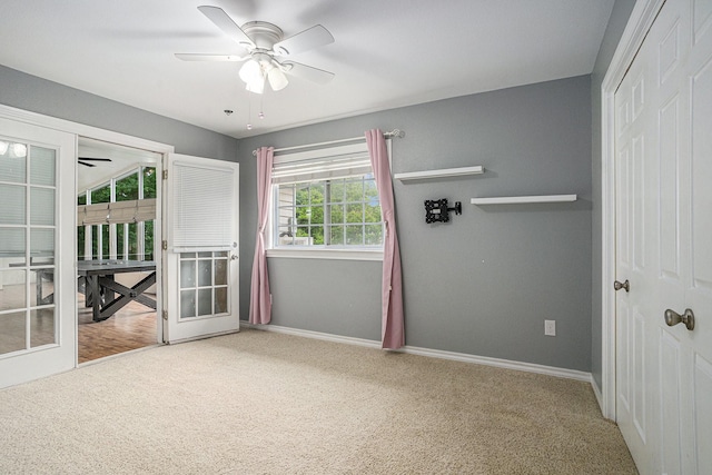 7324 Old Mill Run, Fort Worth, TX 76133 - unfurnished bedroom with a closet, carpet floors, a ceiling fan, baseboards, and access to exterior