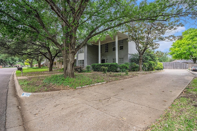 7324 Old Mill Run, Fort Worth, TX 76133 - view of home's exterior with concrete driveway, stucco siding, and fence