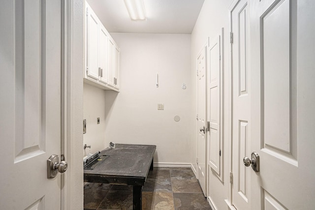 7324 Old Mill Run, Fort Worth, TX 76133 - laundry area with baseboards, stone finish flooring, cabinet space, and electric dryer hookup