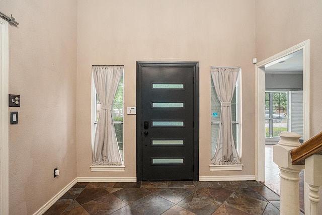 7324 Old Mill Run, Fort Worth, TX 76133 - foyer entrance with baseboards, a towering ceiling, and stone tile flooring