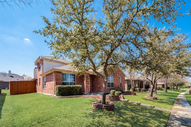 2925 Clear Creek Dr, Rockwall, TX 75032 - view of front of property featuring brick siding, fence, and a front yard