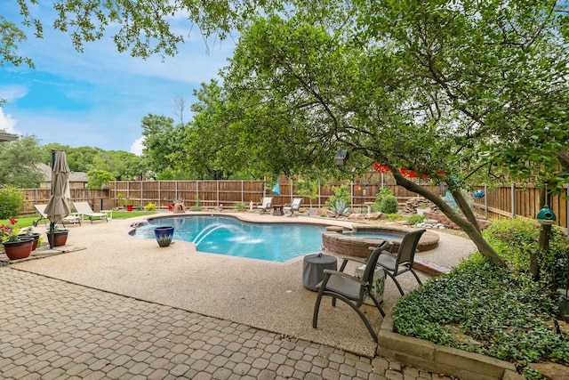 view of swimming pool with a patio, an in ground hot tub, a fenced in pool, and a fenced backyard
