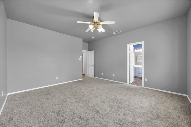 unfurnished bedroom featuring ceiling fan, ensuite bathroom, carpet flooring, baseboards, and visible vents