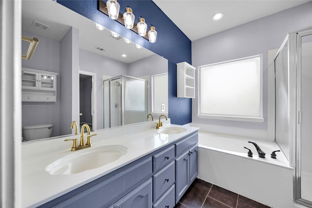 full bath featuring tile patterned flooring, a stall shower, double vanity, and a sink