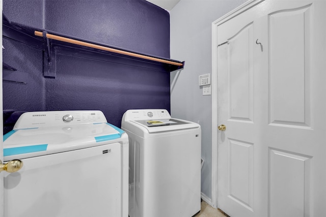 laundry area featuring washer and dryer and laundry area