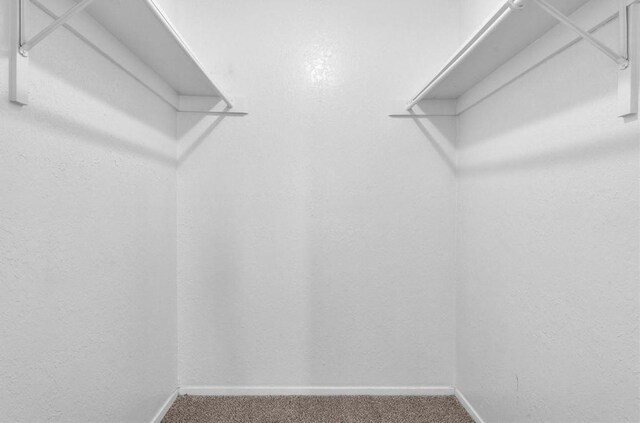 5316 Columbia Ave, Dallas, TX 75214 - walk in closet featuring carpet