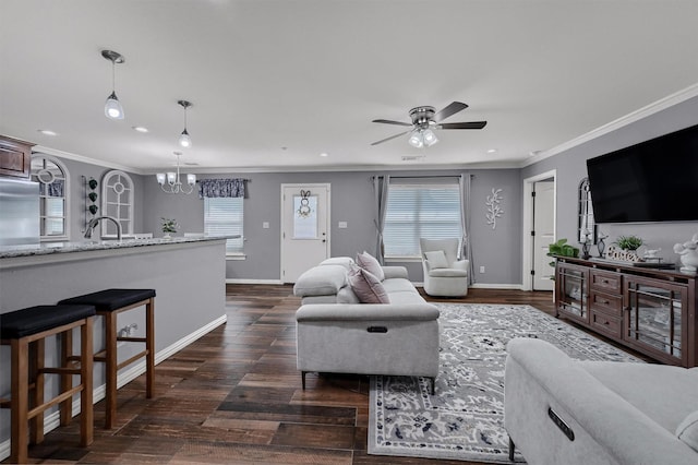 717 S Elm St, Sherman, TX 75090 - living area with a healthy amount of sunlight, crown molding, and dark wood-style floors