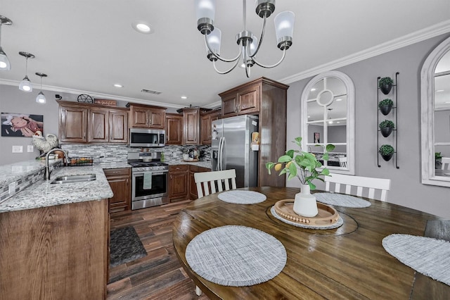 717 S Elm St, Sherman, TX 75090 - dining area with crown molding, visible vents, a chandelier, and dark wood finished floors