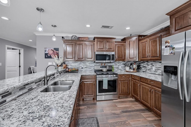 717 S Elm St, Sherman, TX 75090 - kitchen with a sink, stainless steel appliances, tasteful backsplash, crown molding, and visible vents