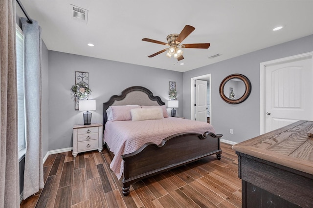 717 S Elm St, Sherman, TX 75090 - bedroom with baseboards, visible vents, and dark wood finished floors