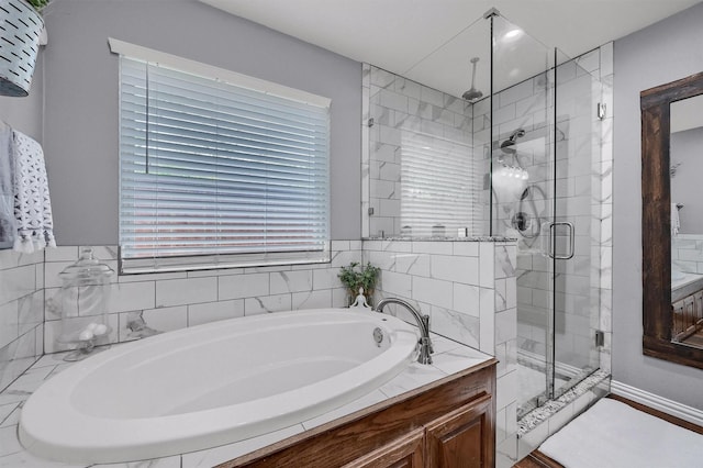 717 S Elm St, Sherman, TX 75090 - bathroom featuring a garden tub and a shower stall
