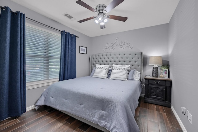 717 S Elm St, Sherman, TX 75090 - bedroom with visible vents, wood finished floors, and baseboards