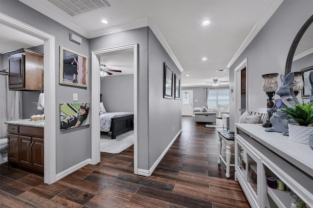 717 S Elm St, Sherman, TX 75090 - hallway featuring ornamental molding, visible vents, baseboards, and dark wood finished floors