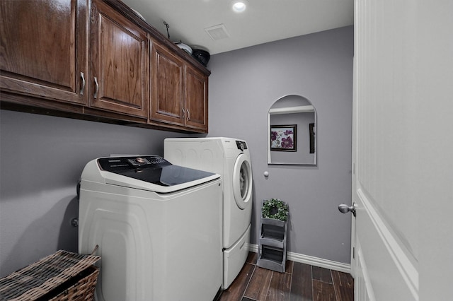 717 S Elm St, Sherman, TX 75090 - clothes washing area featuring dark wood-style floors, cabinet space, washer and clothes dryer, visible vents, and baseboards
