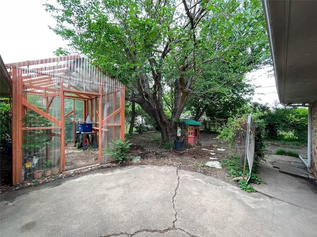 view of patio / terrace with an outdoor structure and an exterior structure