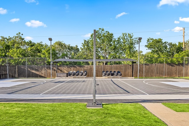 view of basketball court featuring fence and community basketball court