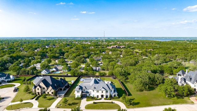 drone / aerial view featuring a residential view and a water view