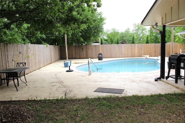 view of pool with a fenced in pool, a fenced backyard, and a patio area