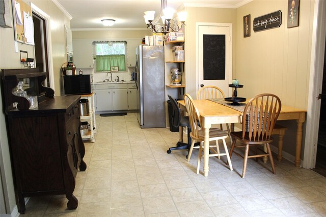 dining room featuring a chandelier and crown molding