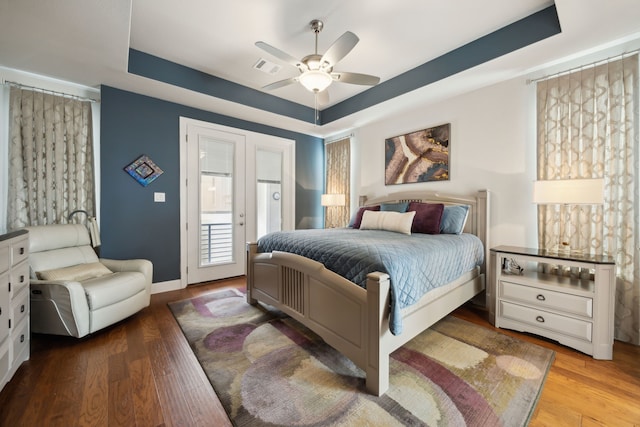 8218 Laflin Ln, Dallas, TX 75231 - bedroom with access to outside, a raised ceiling, wood finished floors, and visible vents