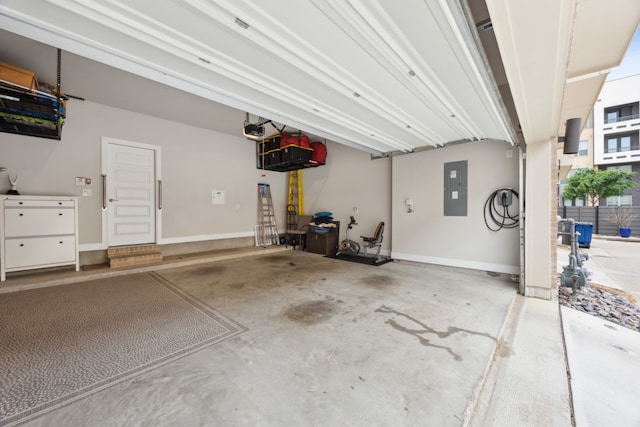 8218 Laflin Ln, Dallas, TX 75231 - garage with baseboards, a garage door opener, and electric panel