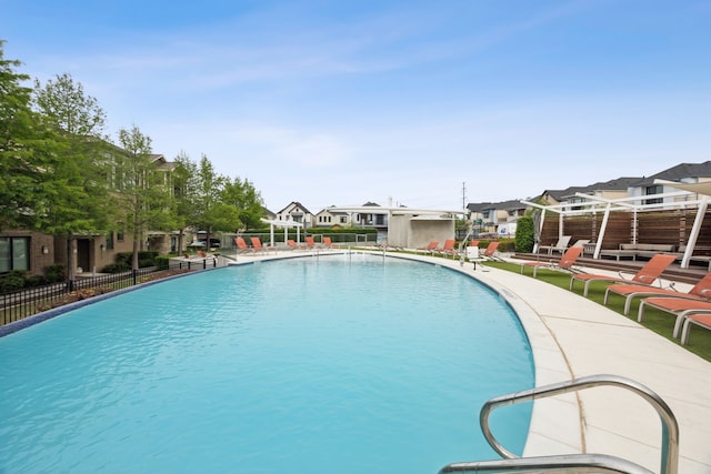 8218 Laflin Ln, Dallas, TX 75231 - community pool with a patio area, fence, and a residential view