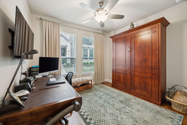 8218 Laflin Ln, Dallas, TX 75231 - home office with baseboards, ceiling fan, and wood finished floors