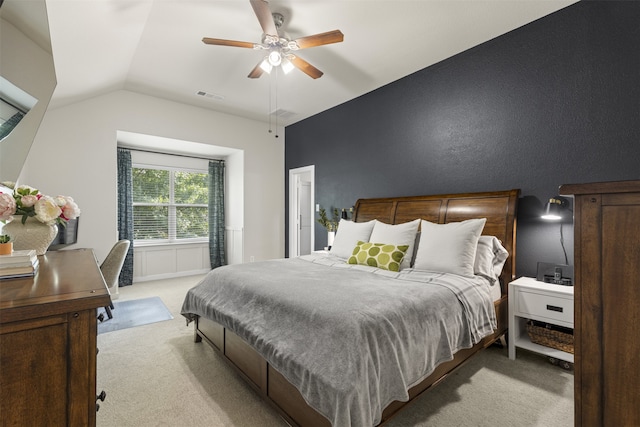 bedroom featuring a ceiling fan, light carpet, lofted ceiling, and visible vents