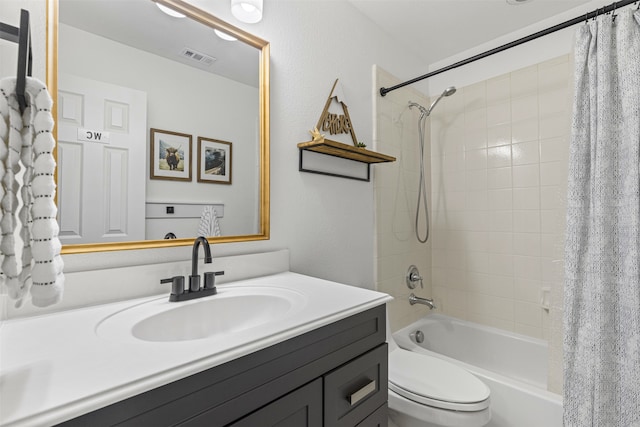 bathroom with shower / bath combo with shower curtain, visible vents, toilet, and vanity