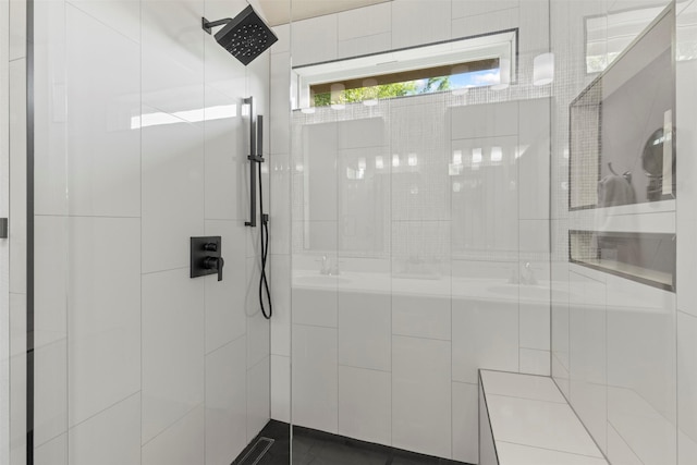 bathroom with a tile shower