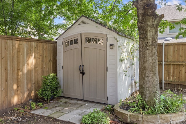 view of shed with a fenced backyard