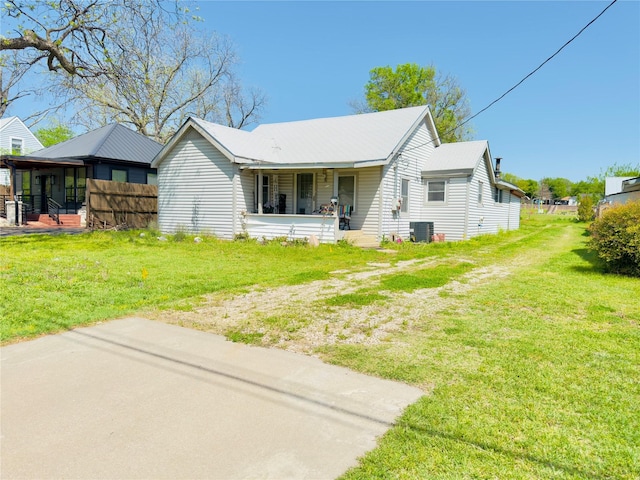 1406 N Main St, Weatherford, TX 76086 - view of front of home with covered porch and central AC unit