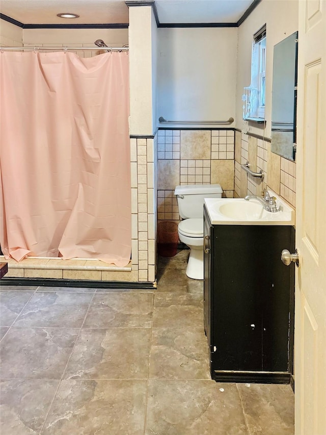 1406 N Main St, Weatherford, TX 76086 - full bathroom with vanity, tile walls, ornamental molding, a stall shower, and a wainscoted wall