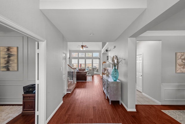 corridor with stairway and wood finished floors