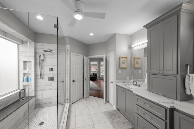 bathroom featuring recessed lighting, a stall shower, ceiling fan, and vanity