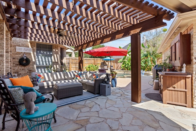 view of patio / terrace with an outdoor hangout area, a fenced backyard, and a pergola