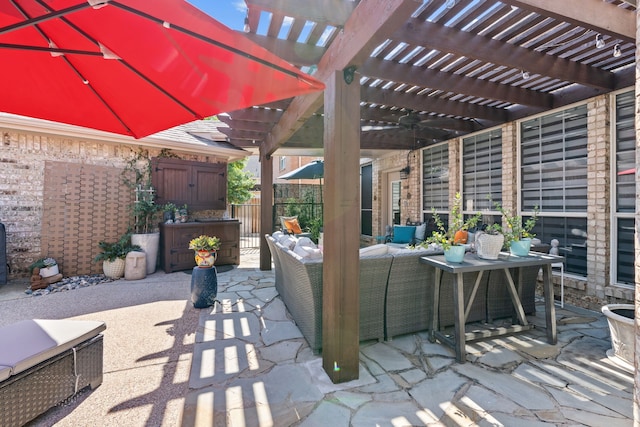 view of patio / terrace with outdoor lounge area, fence, and a pergola
