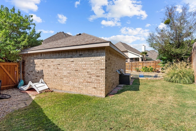 view of yard featuring a gate and a fenced backyard