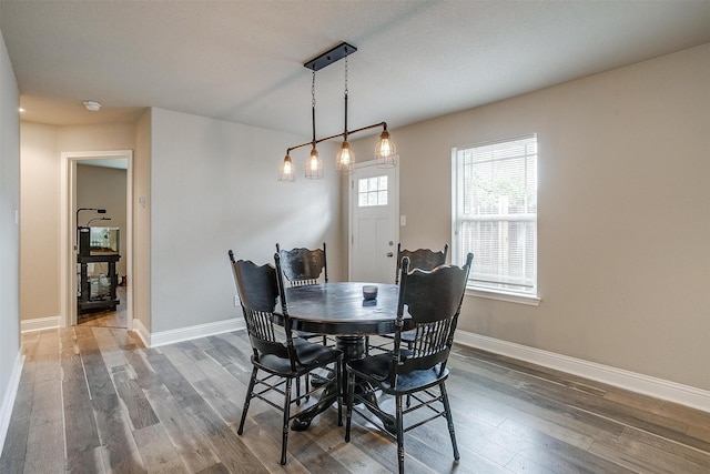 dining room with wood finished floors and baseboards