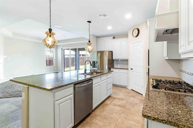 kitchen featuring visible vents, white cabinetry, stainless steel appliances, and tasteful backsplash