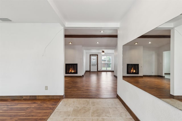 416 Cambridge Dr, Richardson, TX 75080 - unfurnished living room featuring a glass covered fireplace, a ceiling fan, wood finished floors, recessed lighting, and baseboards
