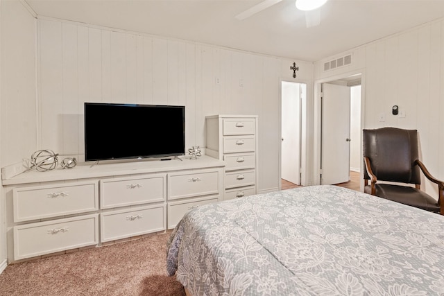 carpeted bedroom featuring visible vents and ceiling fan