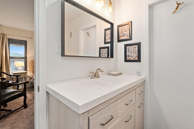 bathroom featuring visible vents and vanity