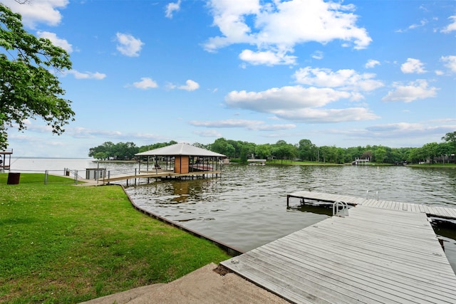 dock area featuring a yard and a water view