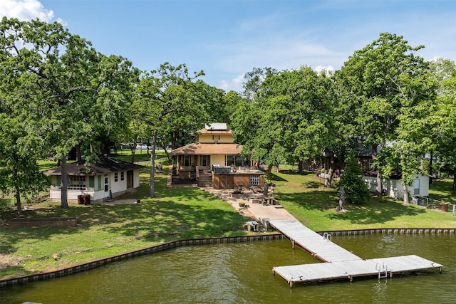 view of dock featuring a lawn, stairway, and a deck with water view