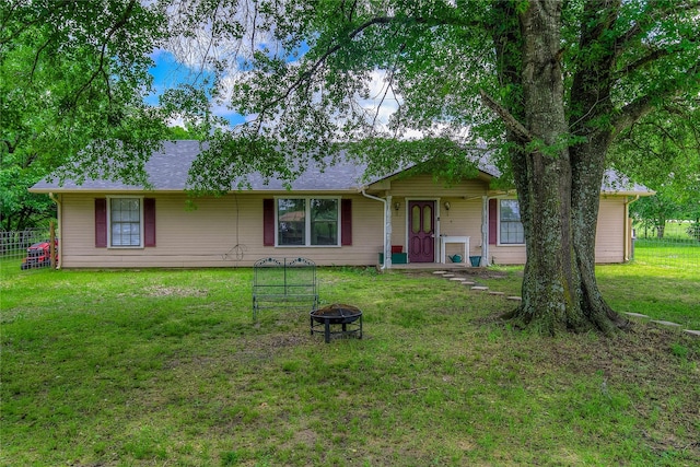 1829 County Road 1103, Sulphur Springs, TX 75482 - back of house with an outdoor fire pit and a shingled roof