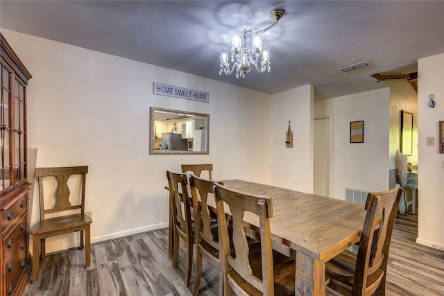 1829 County Road 1103, Sulphur Springs, TX 75482 - dining room with a chandelier and light wood finished floors