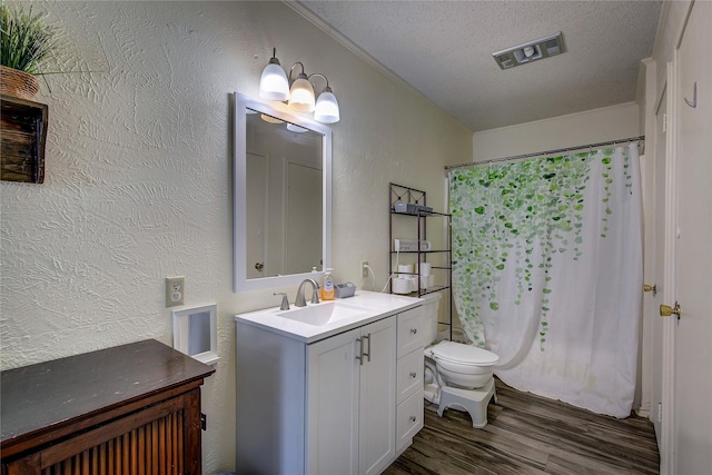 1829 County Road 1103, Sulphur Springs, TX 75482 - bedroom featuring wood finished floors, an office area, baseboards, ceiling fan, and a textured ceiling