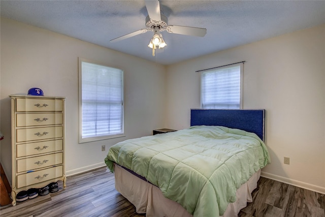 1829 County Road 1103, Sulphur Springs, TX 75482 - bedroom with wood finished floors, baseboards, and ceiling fan